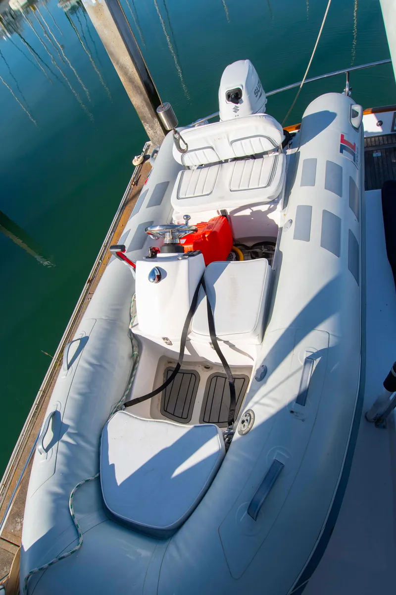 Slide: The Image of Inflatable boat docked beside a 2000 Grand Banks 42 Classic yacht. - 26
