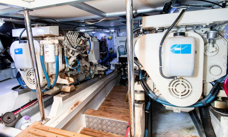 Slide: The Image of Engine room of a 2000 Grand Banks 42 Classic yacht, showcasing dual engines. - 28