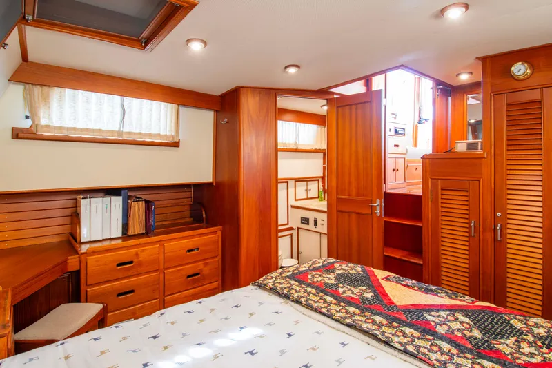 Slide: The Image of Luxurious cabin interior of 2000 Grand Banks 42 Classic yacht with wooden furnishings. - 47