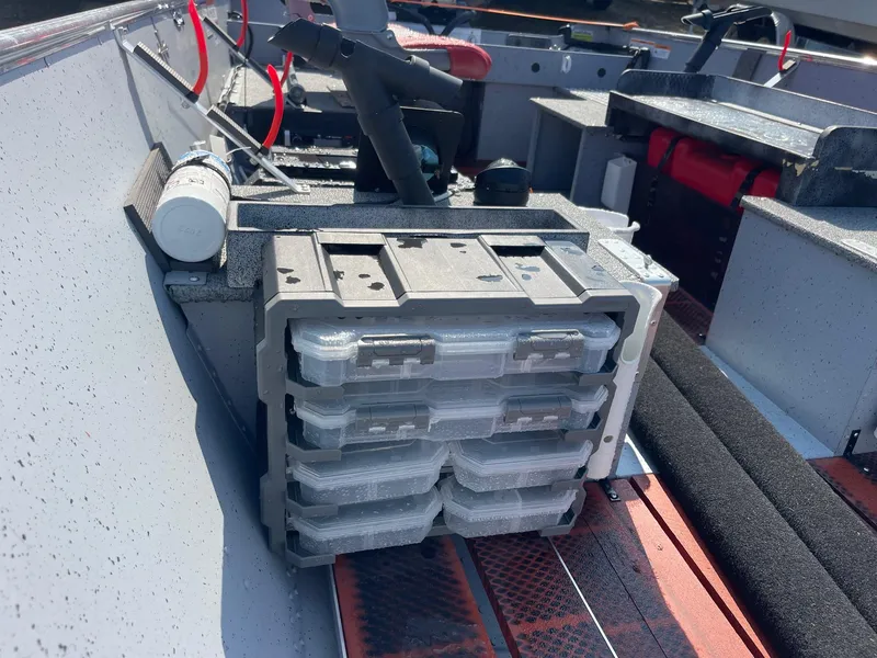 Slide: The Image of Interior view of 2025 Lund SSV-16 Tiller boat with storage compartments and equipment. - 14