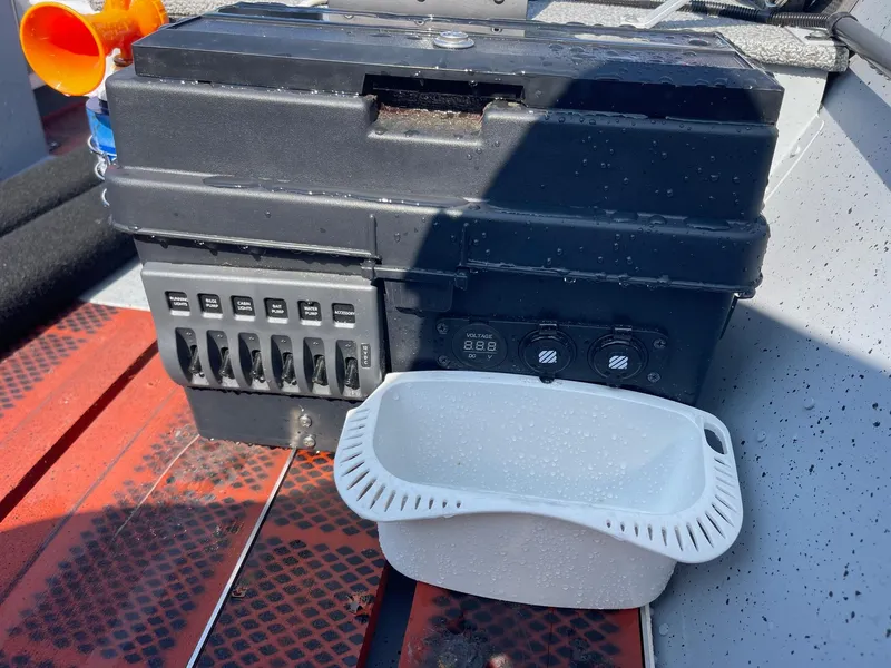 Slide: The Image of Control panel on 2025 Lund SSV-16 Tiller boat with white container. - 15