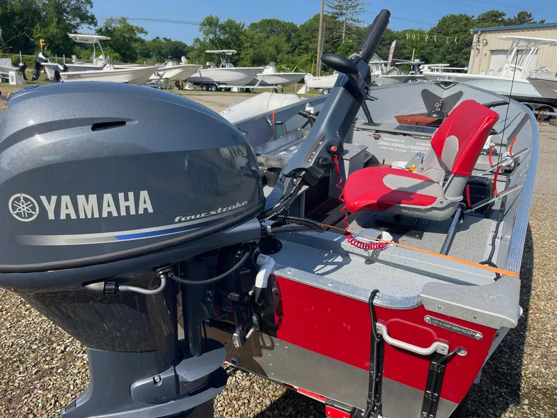 Slide: The Image of 2025 Lund SSV-16 Tiller boat with Yamaha outboard motor, featuring red seating. - 4