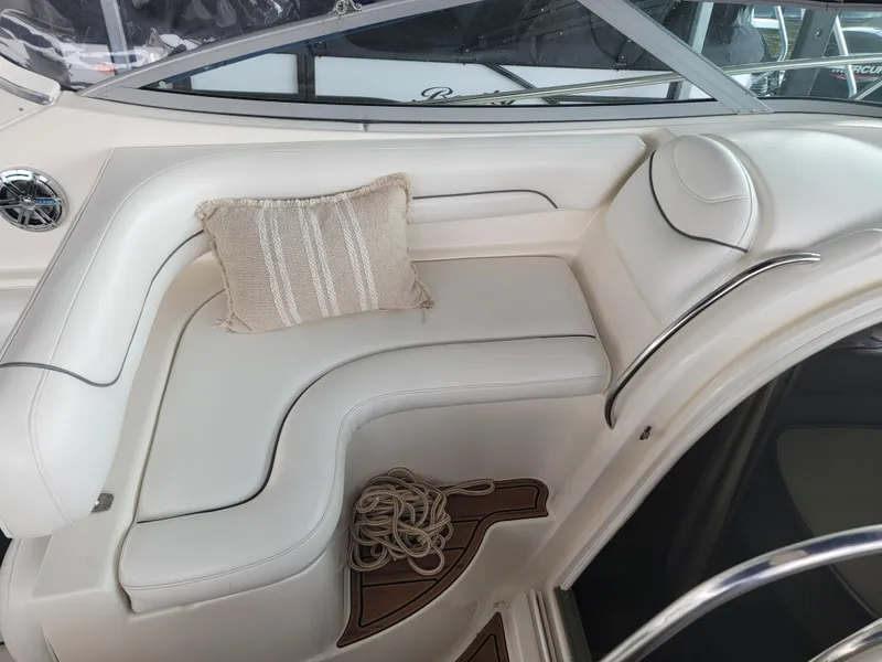 Slide: The Image of Luxurious seating area on a 2004 Maxum 3100 SE boat with cushion and rope. - 19