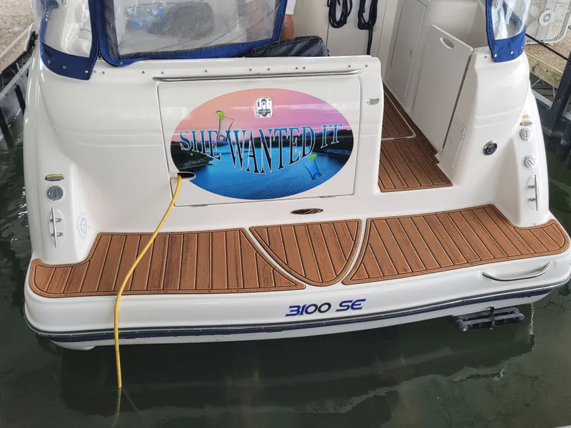 Slide: The Image of 2004 Maxum 3100 SE boat with custom "She Wanted It" decal on the stern. - 21