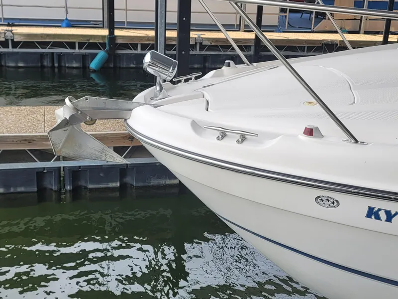 Slide: The Image of 2004 Maxum 3100 SE boat docked, showing bow and anchor detail. - 24