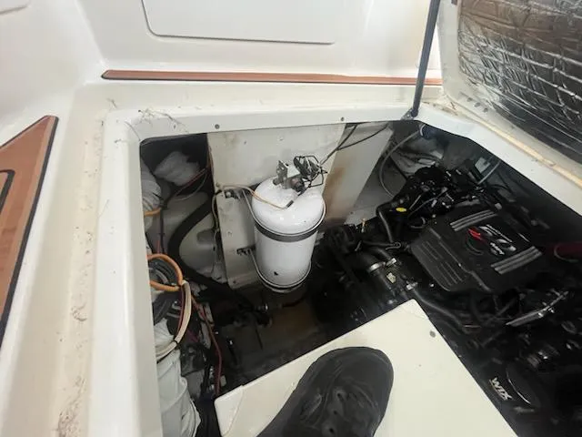 Slide: The Image of Engine compartment of a 2004 Maxum 3100 SE boat, showing mechanical components and wiring. - 3