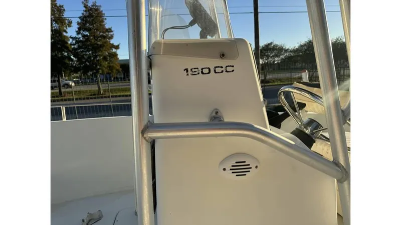 Slide: The Image of 2004 Sea Boss 190 Center Console boat, close-up of console and railing. - 11