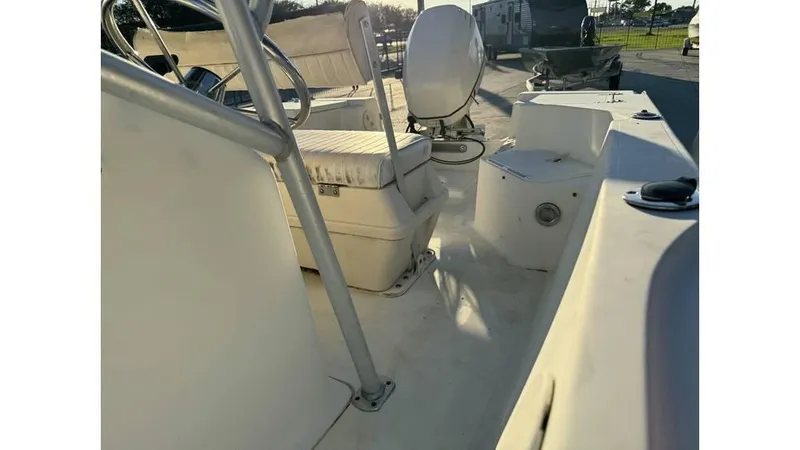 Slide: The Image of 2004 Sea Boss 190 Center Console boat interior with seating and steering wheel. - 12