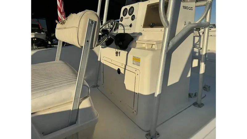 Slide: The Image of 2004 Sea Boss 190 Center Console boat interior with steering wheel and seating. - 7