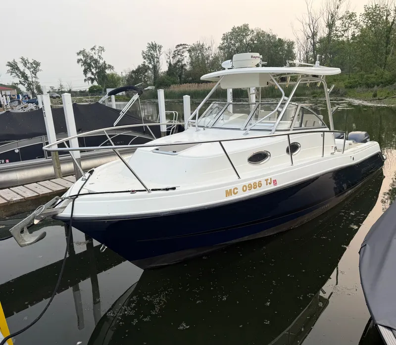 The Image of 2003 Hydra-Sports Vector 2800 WA boat docked in a marina. - 0