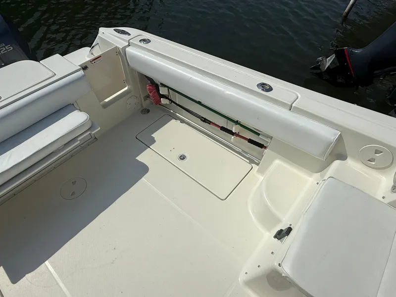 Slide: The Image of 2003 Hydra-Sports Vector 2800 WA boat deck with seating and storage compartments. - 12