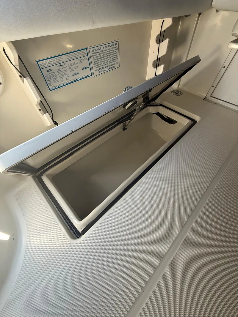 Slide: The Image of Open storage compartment on 2003 Hydra-Sports Vector 2800 WA boat. - 15