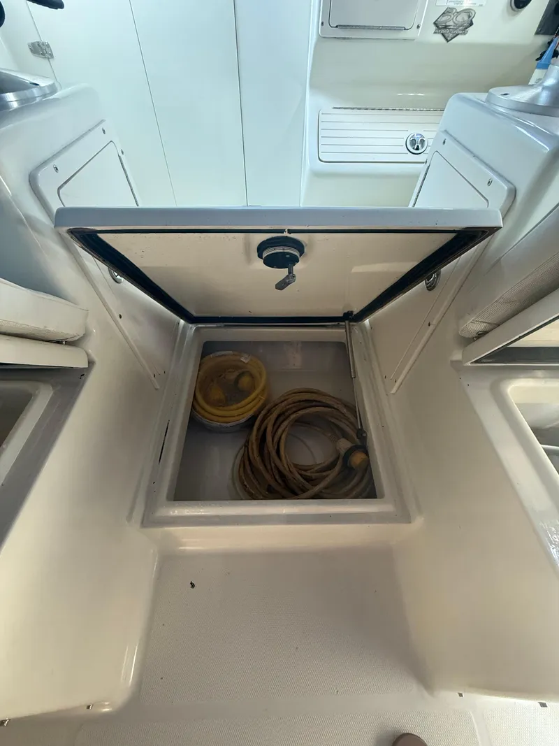 Slide: The Image of Open storage compartment on a 2003 Hydra-Sports Vector 2800 WA boat. - 17