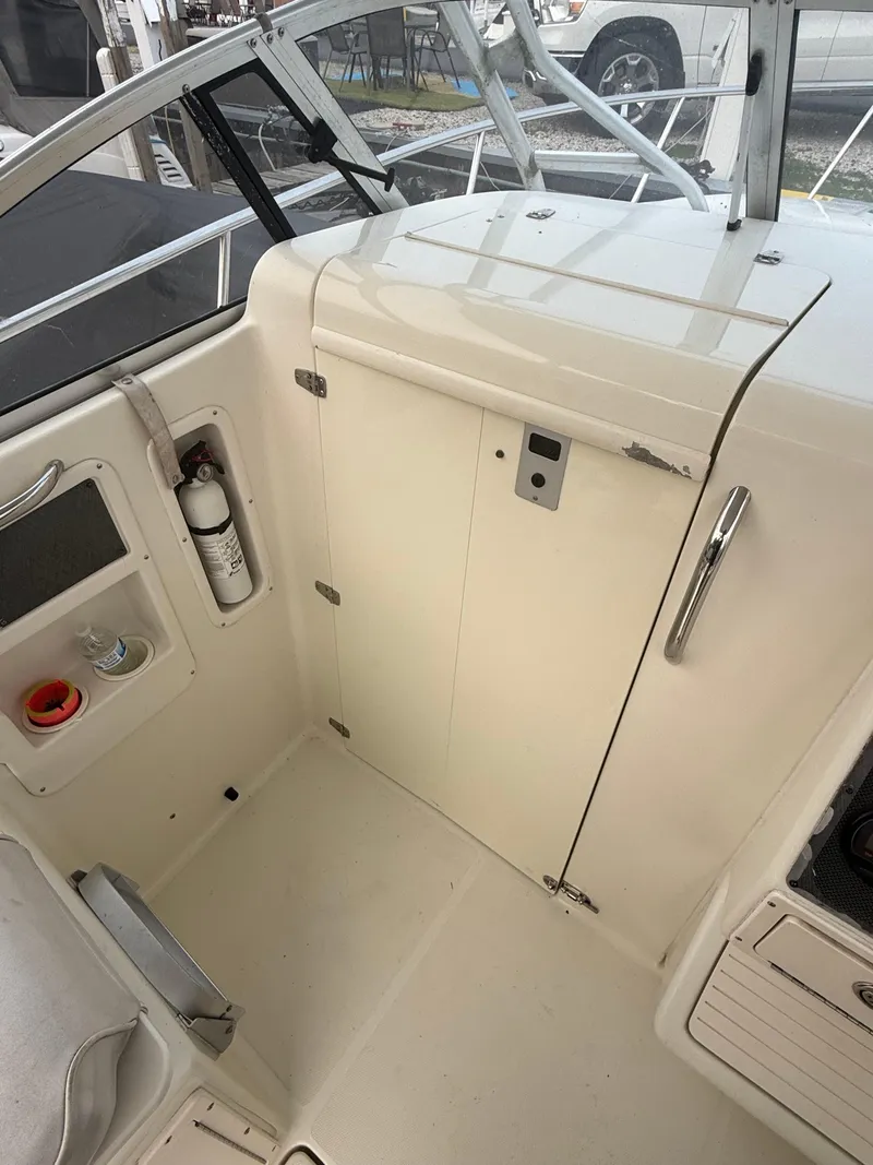Slide: The Image of 2003 Hydra-Sports Vector 2800 WA boat interior with storage and safety equipment. - 25