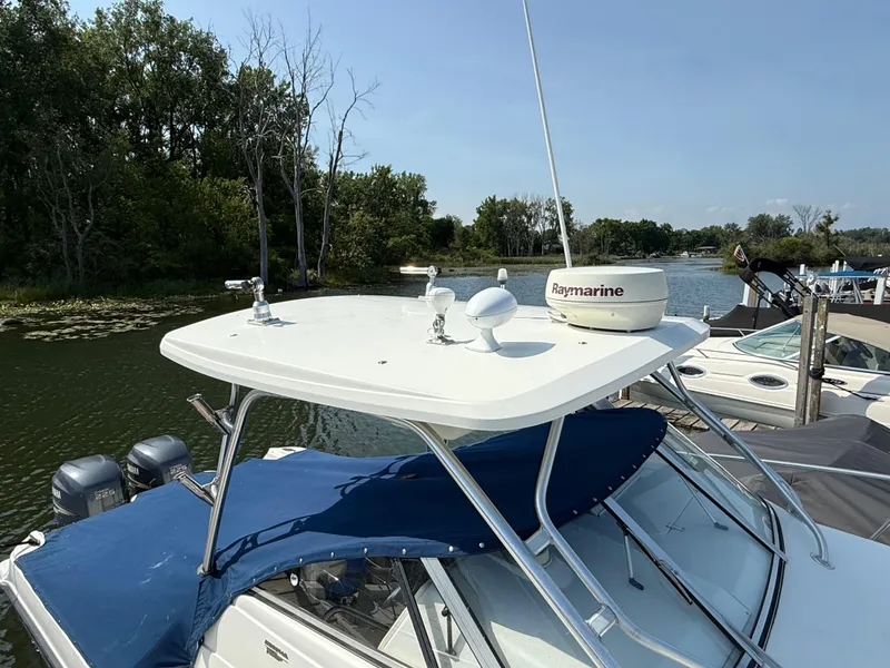 Slide: The Image of 2003 Hydra-Sports Vector 2800 WA boat with Raymarine equipment docked by a scenic lake. - 33