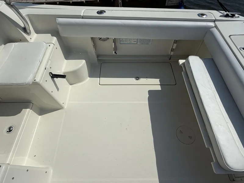 Slide: The Image of 2003 Hydra-Sports Vector 2800 WA boat interior with seating and storage compartments. - 4