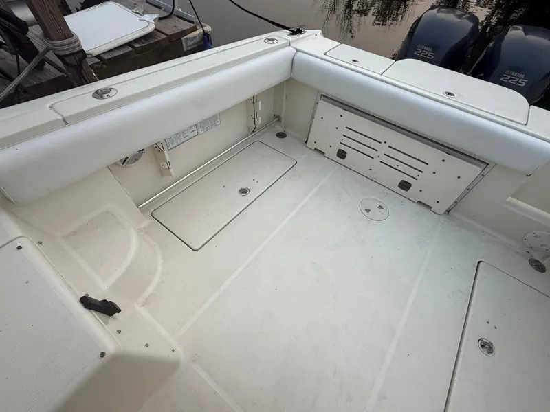 Slide: The Image of 2003 Hydra-Sports Vector 2800 WA boat interior with spacious deck and twin engines. - 5