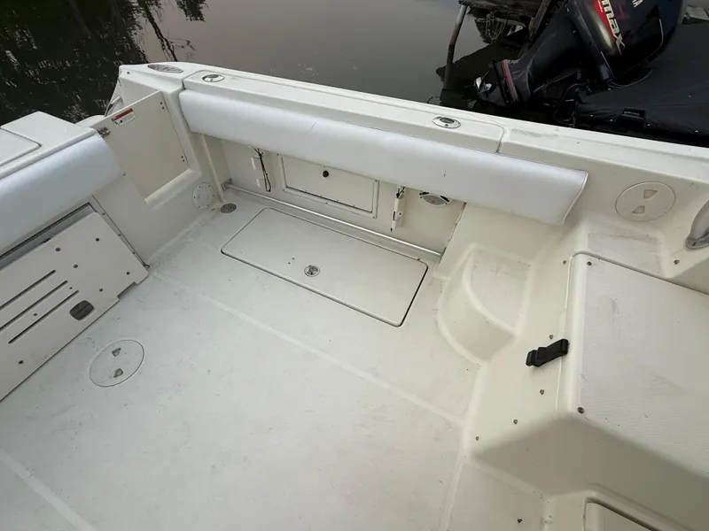 Slide: The Image of 2003 Hydra-Sports Vector 2800 WA boat interior with white seating and storage compartments. - 8