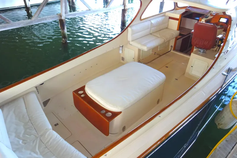 Slide: The Image of 1995 Hinckley Picnic Boat Classic interior with cushioned seating and elegant wood accents. - 2