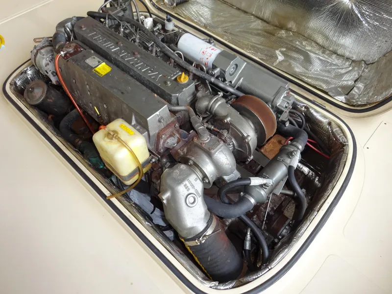 Slide: The Image of Engine compartment of a 1995 Hinckley Picnic Boat Classic, showcasing detailed mechanical components. - 36