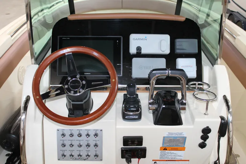 Slide: The Image of 2018 Chris-Craft Catalina 26 helm with Garmin navigation and wooden steering wheel. - 14