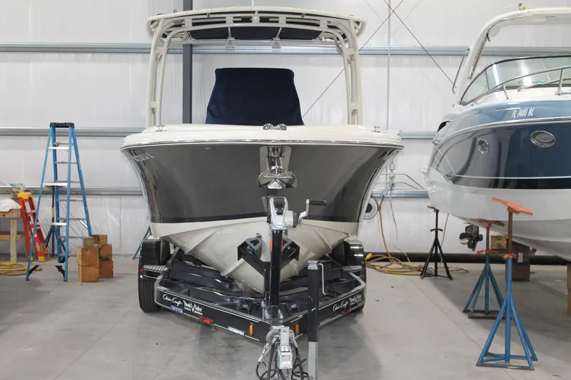 Slide: The Image of 2018 Chris-Craft Catalina 26 boat on trailer in storage facility. - 2