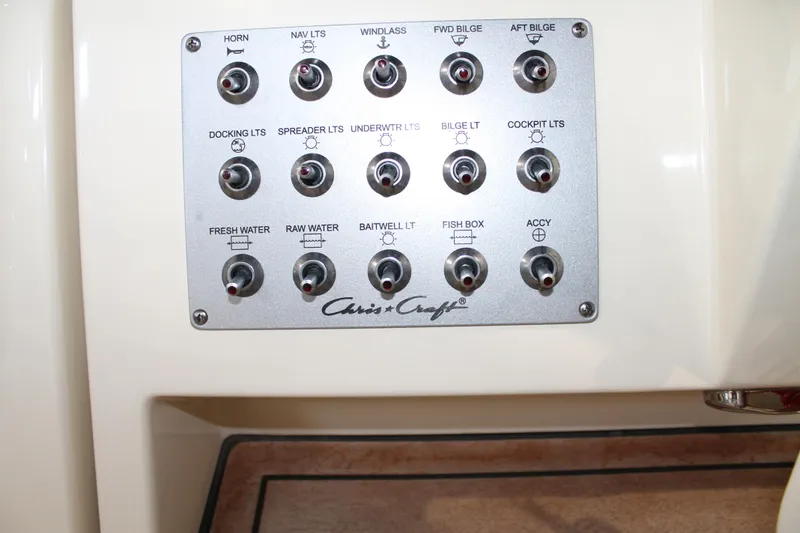 Slide: The Image of Control panel of 2018 Chris-Craft Catalina 26 boat with labeled switches. - 22