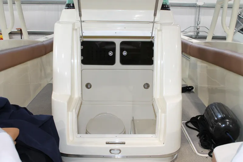 Slide: The Image of 2018 Chris-Craft Catalina 26 boat interior with open storage compartment. - 25