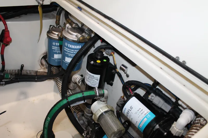 Slide: The Image of Engine compartment of a 2018 Chris-Craft Catalina 26 with Yamaha filters and hoses. - 7