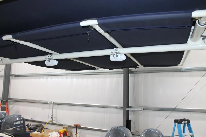 Slide: The Image of 2018 Chris-Craft Catalina 26 boat canopy in a storage facility. - 8