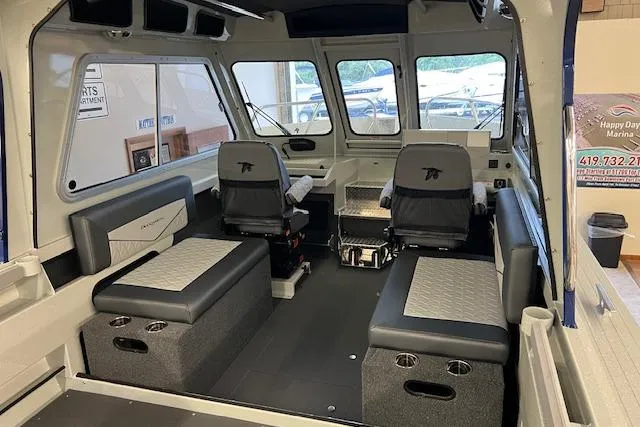 Slide: The Image of Interior of 2026 Duckworth 22 Pacific Pro boat with seating and helm. - 13