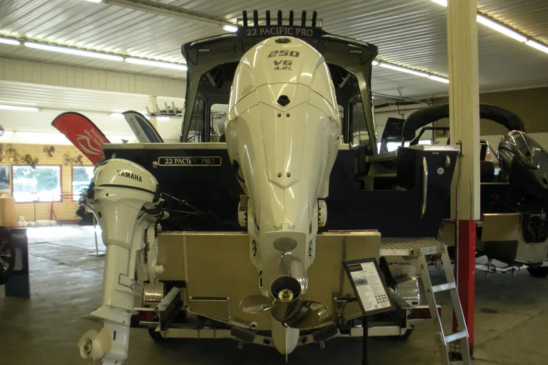 Slide: The Image of 2026 Duckworth 22 Pacific Pro boat with Yamaha and 250 V6 engines in showroom. - 18