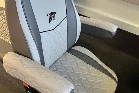 Slide: The Image of Luxury seating in 2026 Duckworth 22 Pacific Pro boat, featuring quilted design and logo. - 8