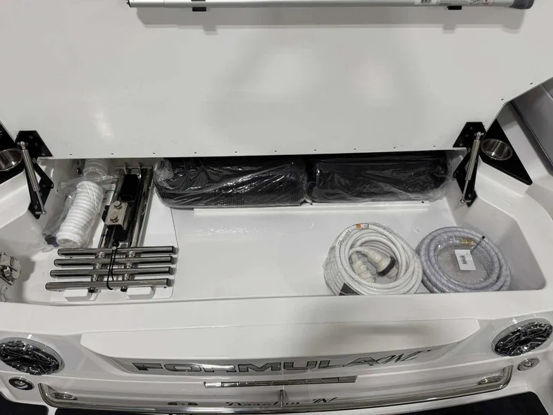 Slide: The Image of 2026 Formula 360 Crossover Bowrider I/O storage compartment with ropes and accessories. - 30