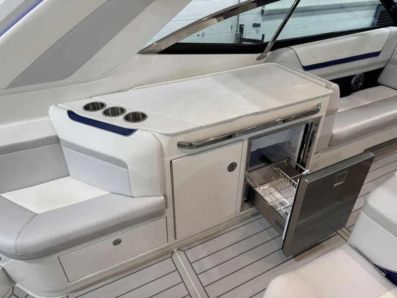 Slide: The Image of 2026 Formula 360 Crossover Bowrider I/O interior with seating and open drawer. - 37