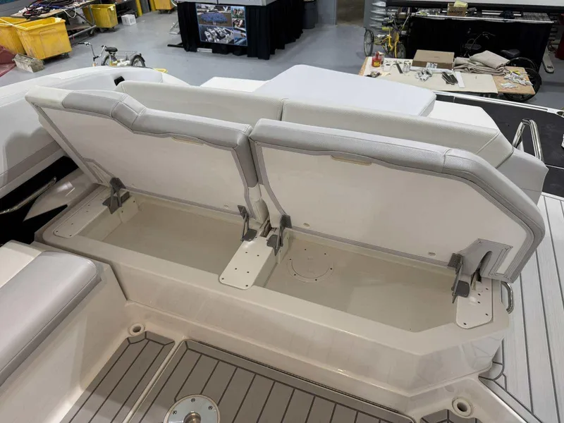 Slide: The Image of 2026 Formula 360 Crossover Bowrider I/O with open storage compartment on deck. - 51