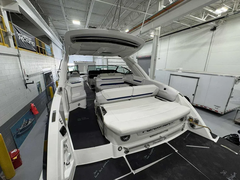 Slide: The Image of 2026 Formula 360 Crossover Bowrider I/O in a showroom, showcasing luxury seating and design. - 6