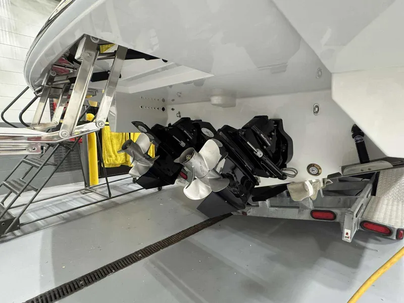 Slide: The Image of 2026 Formula 360 Crossover Bowrider I/O boat with dual propellers on a trailer. - 8