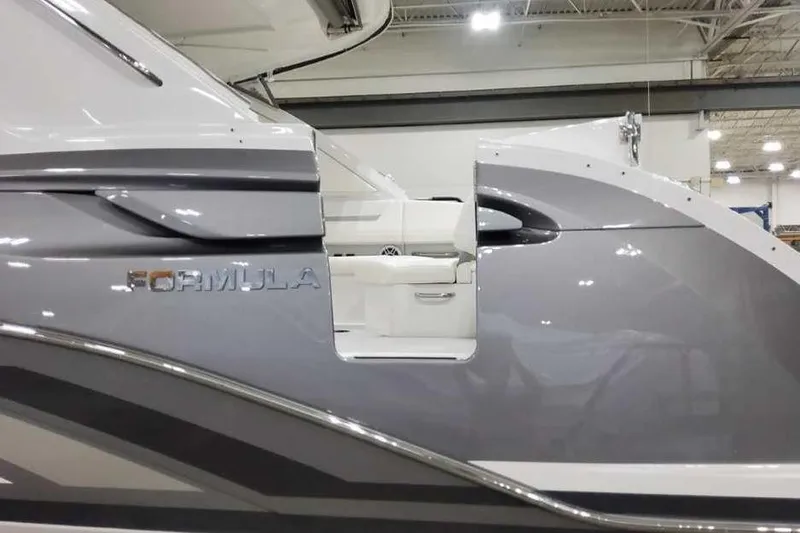 Slide: The Image of 2027 Formula 360 Crossover Bowrider I/O in showroom, showcasing sleek design and branding. - 11