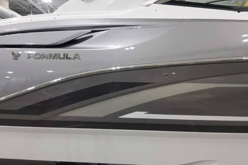 Slide: The Image of 2027 Formula 360 Crossover Bowrider I/O, sleek gray and white exterior design. - 9