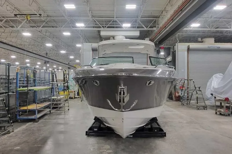 Slide: The Image of 2027 Formula 360 Crossover Bowrider I/O in a spacious indoor facility. - 2