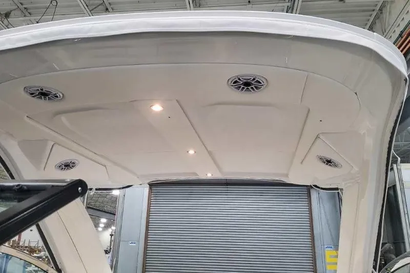 Slide: The Image of 2027 Formula 360 Crossover Bowrider I/O boat interior ceiling with speakers and lights. - 54