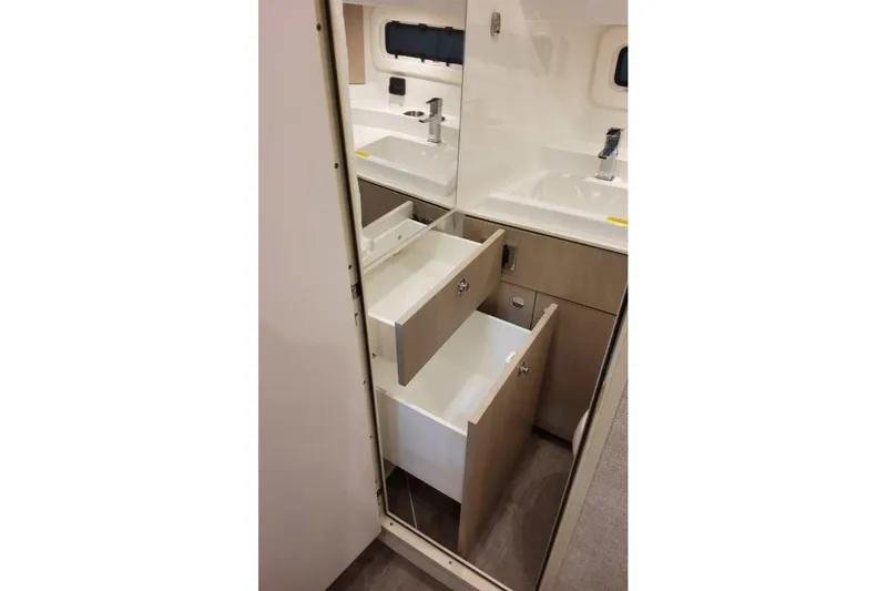 Slide: The Image of Interior of 2027 Formula 360 Crossover Bowrider I/O, featuring modern cabinetry and sink. - 73