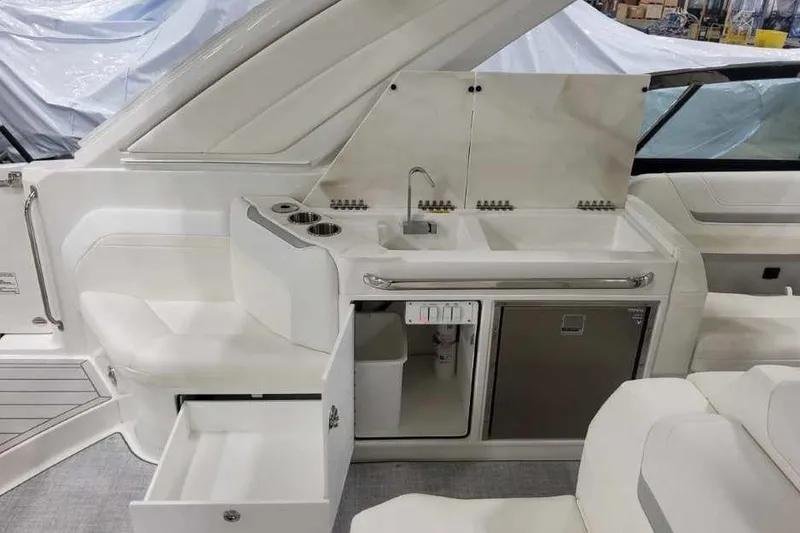 Slide: The Image of 2027 Formula 360 Crossover Bowrider I/O interior with kitchenette and seating area. - 29