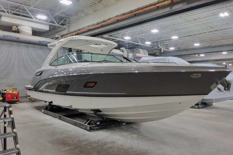Slide: The Image of 2027 Formula 360 Crossover Bowrider I/O in a showroom, showcasing sleek design and modern features. - 3