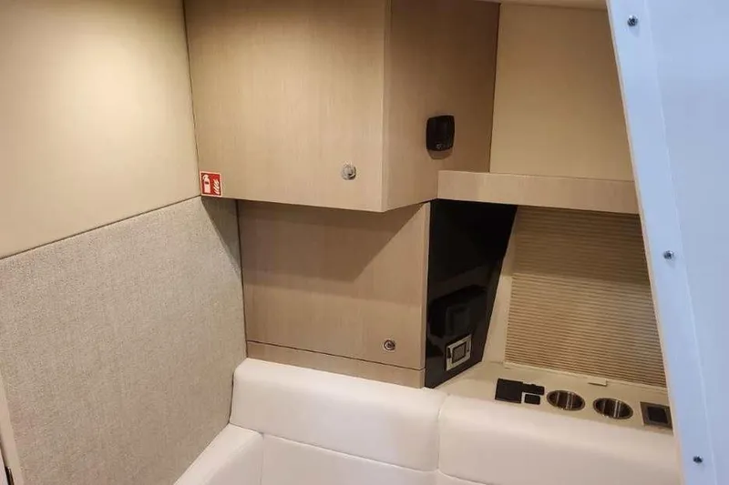Slide: The Image of Interior of 2027 Formula 360 Crossover Bowrider I/O, featuring modern cabinetry and seating. - 60