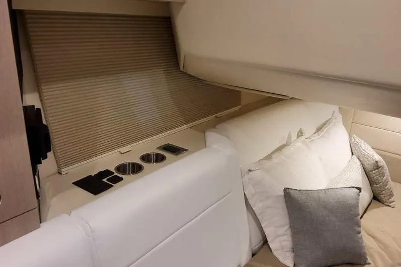 Slide: The Image of Interior of 2027 Formula 360 Crossover Bowrider I/O, featuring cozy seating and cup holders. - 66