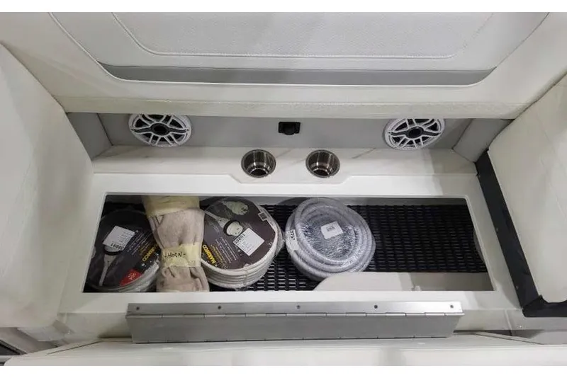 Slide: The Image of Storage compartment in 2027 Formula 360 Crossover Bowrider I/O with speakers and accessories. - 31