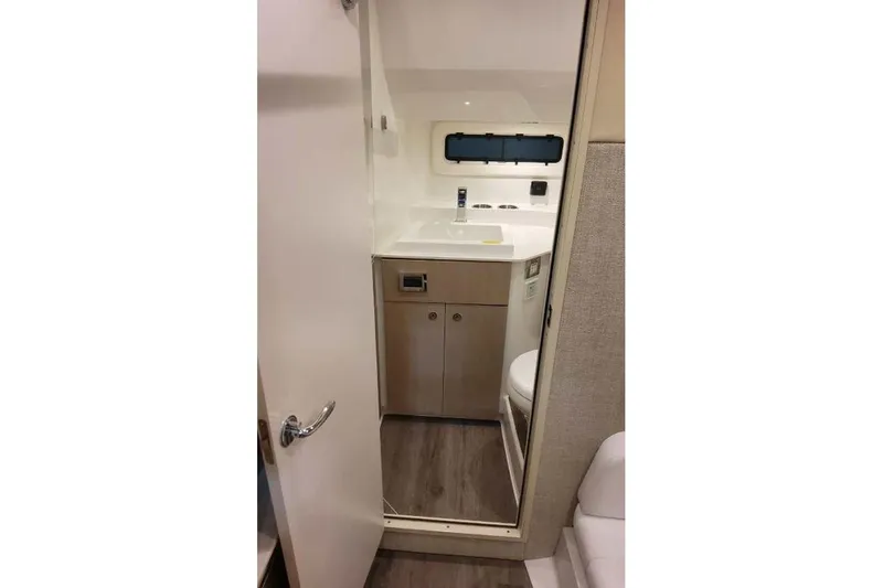 Slide: The Image of Interior of 2027 Formula 360 Crossover Bowrider I/O bathroom with sink and toilet. - 70