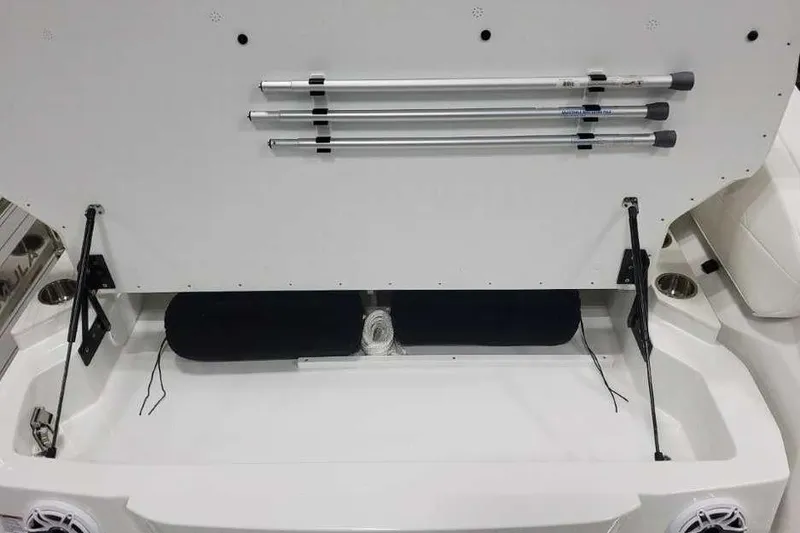 Slide: The Image of Storage compartment of 2027 Formula 360 Crossover Bowrider I/O with poles and accessories. - 15